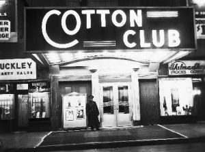 ca. 1920s-1940s, Harlem, Manhattan, New York, New York, USA --- The night spot that best evokes glittering images of Harlem in the 1920s and 1930s is the Cotton Club. While literary urbanites appreciated Harlem Renaissance writers like Langston Hughes, more fun-loving New Yorkers were attracted to the neighborhood's vibrant cabarets. If you were white and well-heeled, you could enjoy African American entertainers like Louis Armstrong and Bill "Bojangles" Robinson at the elegant Cotton Club. --- Image by © Underwood & Underwood/CORBIS