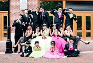 Here is a quincenera girl with her escorts and maid of honors of different ages . 