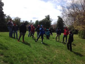 The shadows of our group stand slanted on the sloped ground of earthen fortifications dug by Confederate troops in the winter of 1861-1862