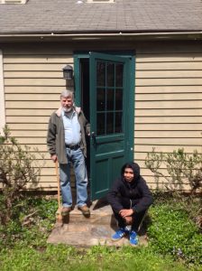 Prof Mccord stands at the original from door to the front porch of the 18th century Jamesson House. The family enclosed this front porch to convert it to bedrooms for the children in the 19th century.