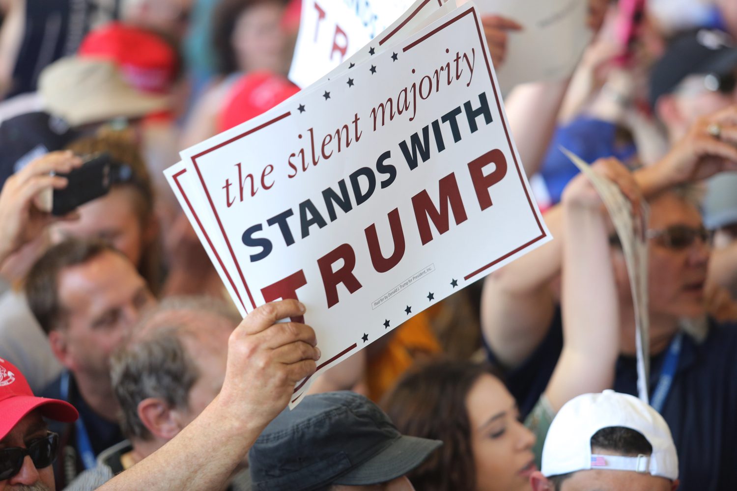 Supporters+hold+signs+at+U.S.+Republican+presidential+candidate+Donald+Trumps+campaign+rally+at+Werner+Enterprises+Hangar+in+Omaha%2C+Nebraska%2C+United+States+May+6%2C+2016.++REUTERS%2FLane+Hickenbottom+-+RTX2D6QU
