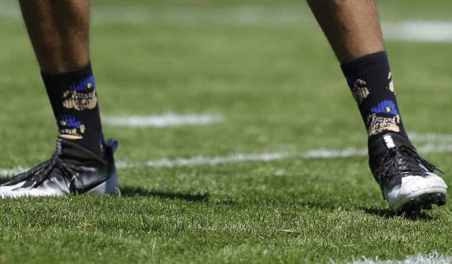 In August 2016 these socks showing police officers as pigs were worn during practice by Kapernick