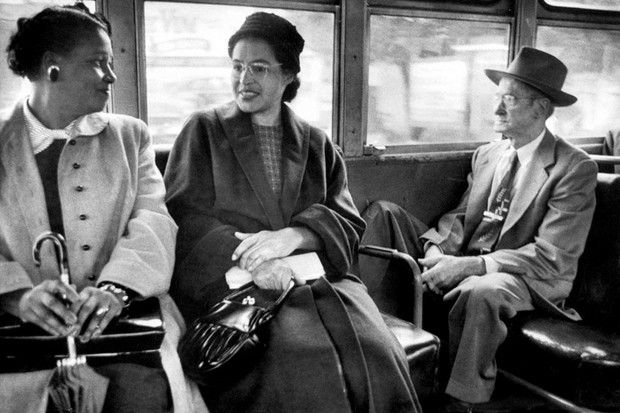 Rosa Parks (C) riding on newly integrated bus following Supreme Court ruling ending successful 381 day boycott of segragated buses. Boycott began when Parks was arrested for refusing to give up her seat to a white person.  (Photo by Don Cravens//Time Life Pictures/Getty Images)